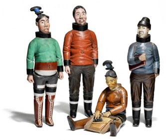 2. Group of four Inuit figures. Driftwood and paint. 